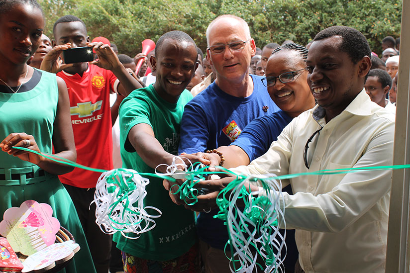Cutting the ribbon to launch the library. (Moses Opobo)