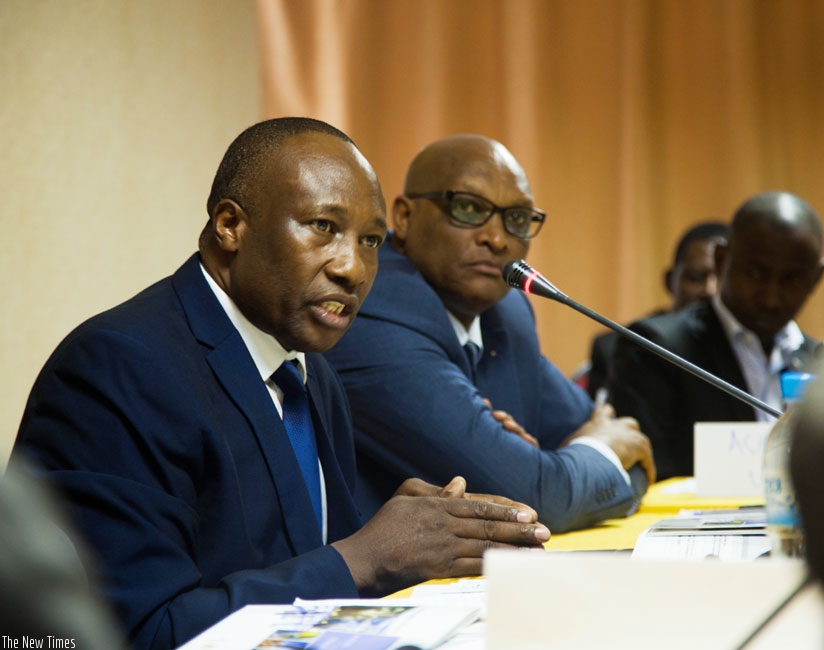 Mugyenyi (left) speaks during the workshop as Rwanda mining body chief looks on. (Teddy Kamanzi)