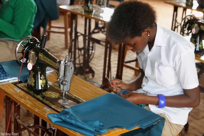 A student at Nelson Mandela Education Center in Bugesera District engages in tailoring on Monday. (Courtesy)