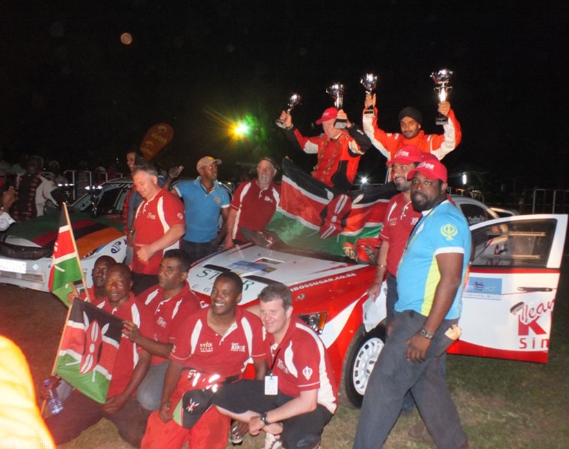 Singh Chatthe Jaspreet (right, holding trophies) celebrates with fans after winning last year's Mt. Gorilla Rally. Courtesy.