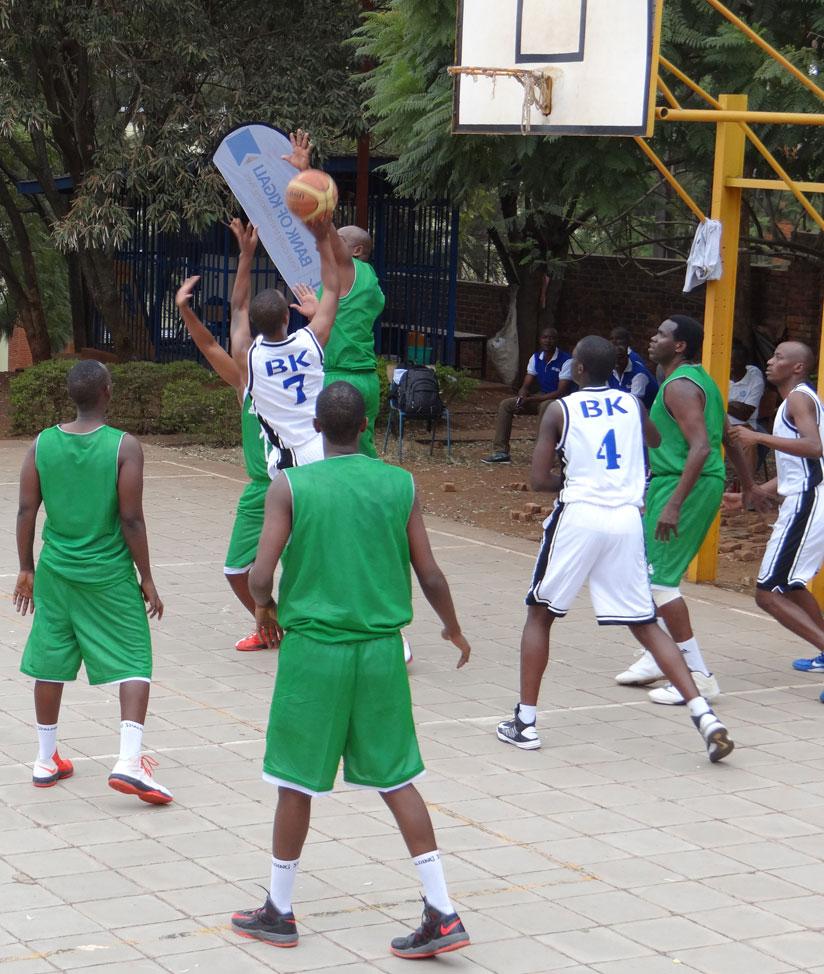 BK's Lionel Hakizimana (#7) goes for a shot as KCB players try to block him in the final yesterday. (Felix Nsengumukiza)