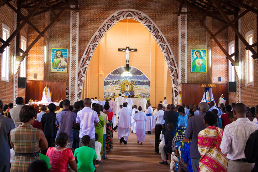 Christians attend a Mass at Ste Famille. The Catholic Church has caused furor among survivors by releasing a list of priests to be celebrated that included two convicted for their role in the 1994 Genocide. (File)
