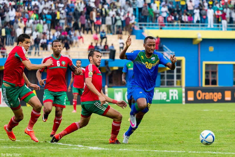 Hegman Ngomirakiza goes past the Moroccan defenders during a game at Amahoro in January. Schools have been challenged on nurturing sports talent in scholars. (T. Kisambira)