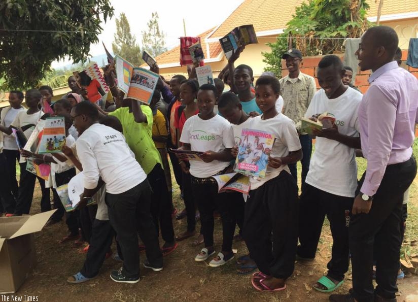 Children showing off the books they received last Saturday. (Lydia Atieno)