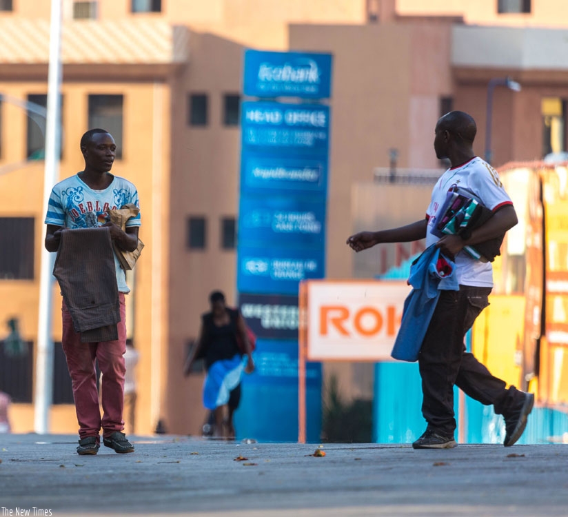 Street vendors sell second-hand clothes in downtown in Kigali. (Timothy Kisambira)