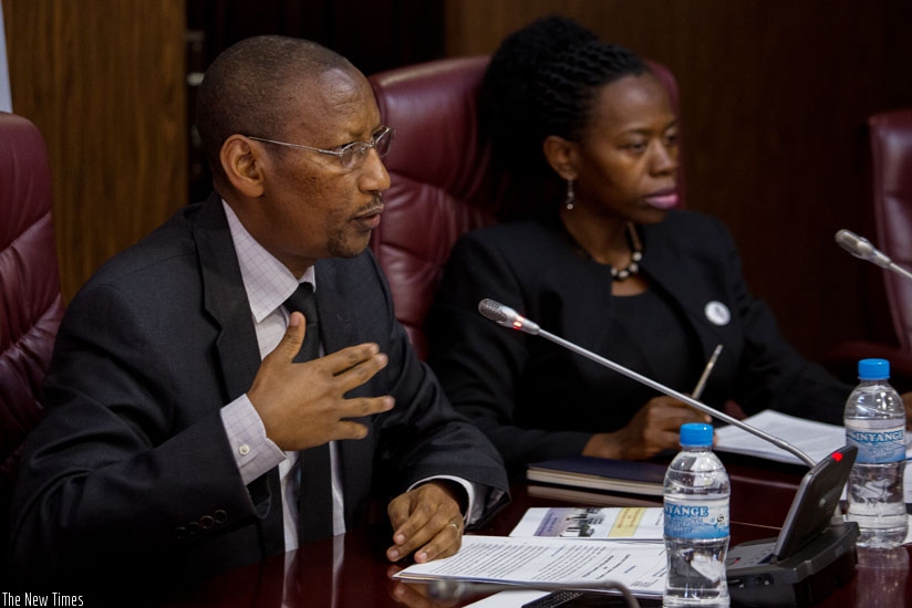 Rwangombwa briefs the media as vice-governor Monique Nsanzabaganwa looks on in Kigali yesterday. (Timothy Kisambira)