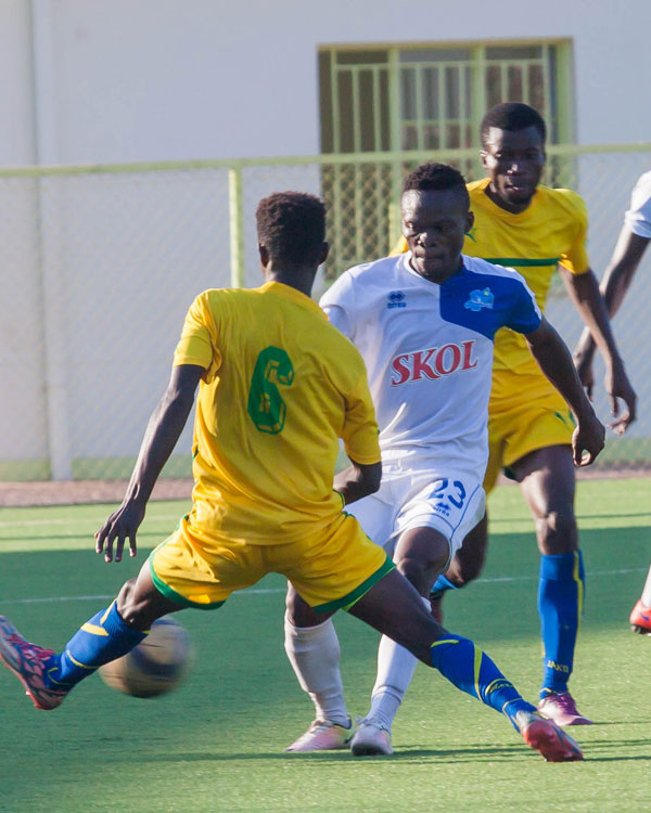 Kwizera Pierro (C) who scored the only goal for Rayon Sport fights for the ball with Ntwari Evode #6 of AS Kigali. (Nadege Imbabazi)