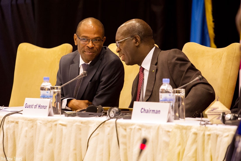 Prime Minister Anastase Murekezi (R) chats with Zambian deputy finance minister Christopher Mvunga during the African Trade Insurance agency (ATI) 16th annual general meeting in Kigali, yesterday. (Timothy Kisambira)