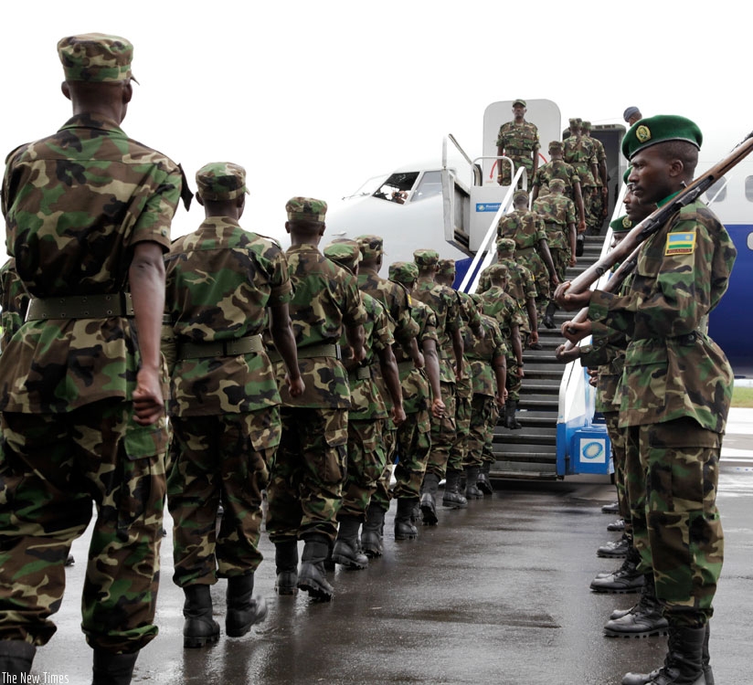 RDF peace Keepers board a RwandAir plane enroute to Darfur at Kigali International Airport in 2012. (File)