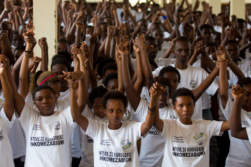 Youth join hands as a sign of solidarity during a civic education training at Gisozi last year. (File)