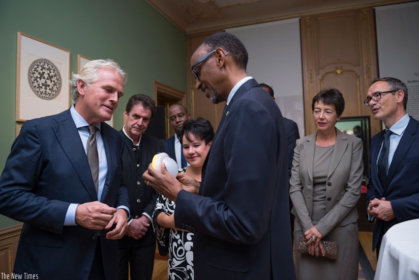 Bart Hartman (left) shows one of NOTS solar lamps to President Paul Kagame. (File)