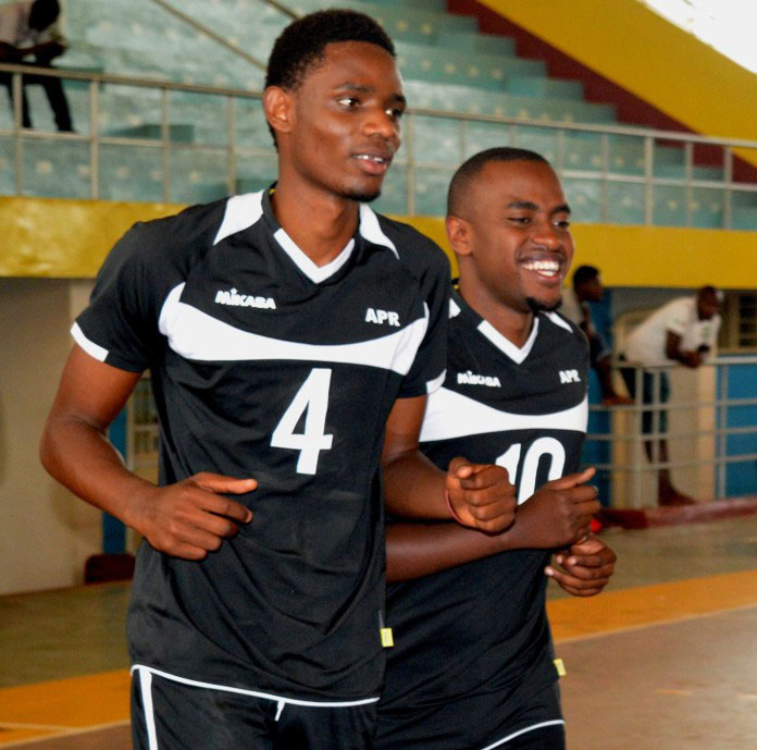 Yves Mutabazi (left) warms up with an APR teammate ahead of a local league match at Amahoro indoor stadium. (File)