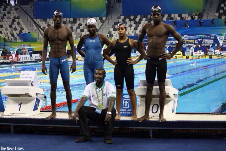 Imaniraguha (R) and Umurungi (in black) along with other swimmers pose for a photo after a training session Shanghai, China. (Courtesy)