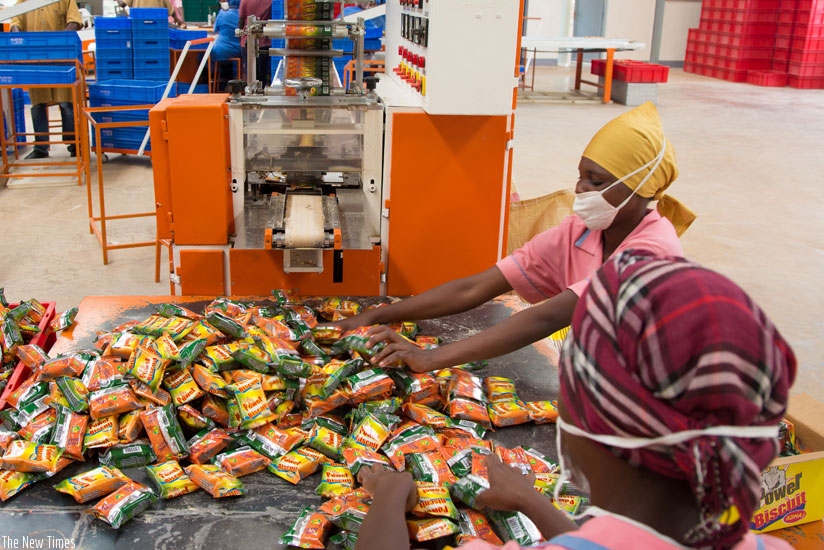 Employees of AMDA biscuits factory in the Kigali Special Economic Zone. High purchasing power for local products attracts investments as businesses are assured of ready market. (File)  