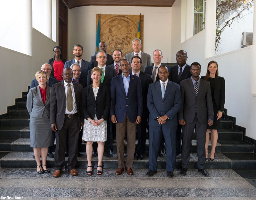 President Paul Kagame in a group photo with a delegation from Wharton Business School, University of Pennsylvania MBA Alumni, Faculty members and business leaders at Village Urugwiro in Kigali yesterday. rn(Village Urugwiro)