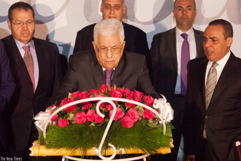 Palestinian President Mahmoud Abbas lays a wreath at the Kigali Genocide Memorial. / Nadege Imbabazi