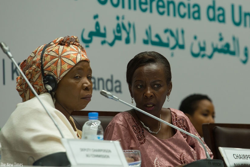 Nkosazana Dlamini-Zuma, the Chairperson of the Africa Union Commission (L) chats with Foreign Affairs minister Louise Mushikiwabo, during yesterday's NEPAD session. / Timothy Kisambira
