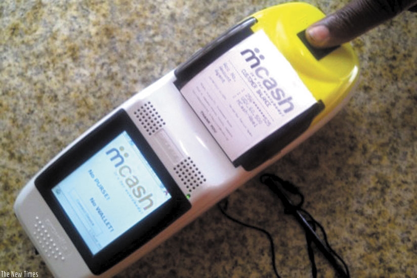 A customer uses biometric technolgy to make a transaction. (Net.)