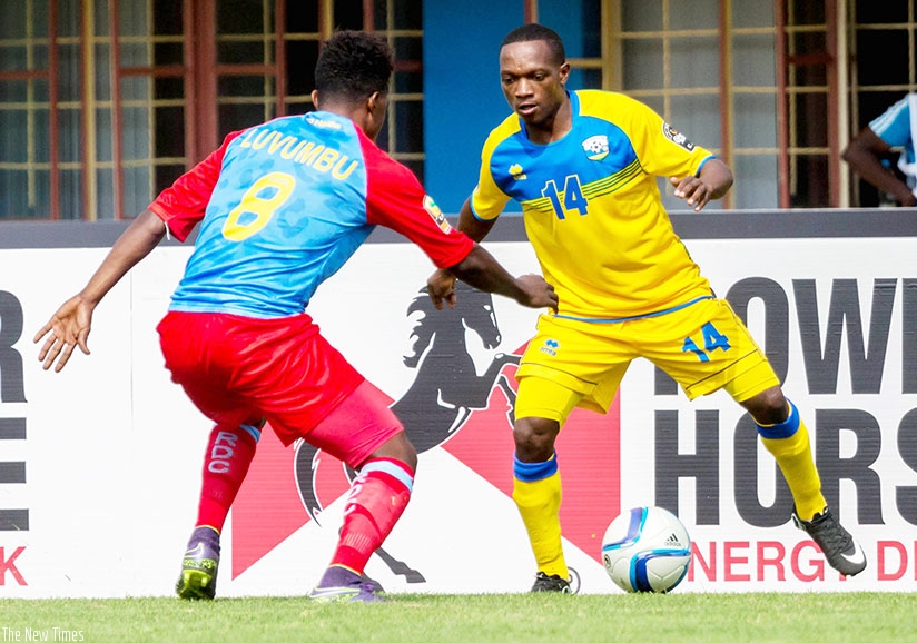 Ndayishimiye tries to go past DR Congo midfielder Heritier Luvumbu during the 2016 CHAN quarter-finals. The Amavubi left-back has joined Police FC. / Timothy Kisambira.