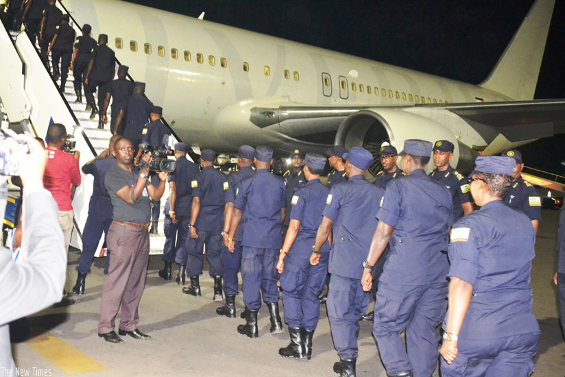 RWAFPU7 contingent boarding a plane at Kigali International Airport for a UN mission in Haiti. / Courtesy
