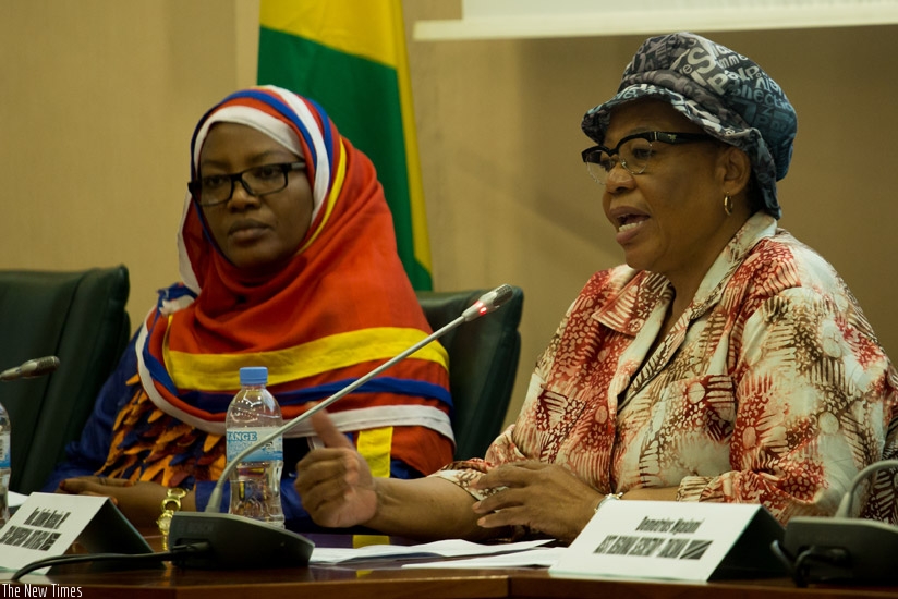 The Chairperson of the executive committee of the Commonwealth Parliamentary Association, Lindiwe Maseko, briefs journalists as Senate vice-president Fatou Harerimana looks on. / T....