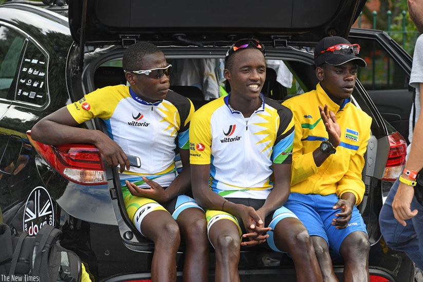 L-R: Jean-Bosco Nsengimana, Samuel Mugisha and  Jean-Claude Uwizeye relaxing at the back of a car in Wales. / Courtesy