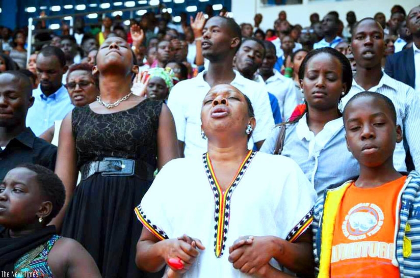 Christians pray during Rwanda Shima Imana crusade last year. / File.