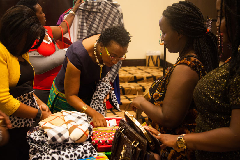 Participants admire Rwandan products at the mini-exhibition that was part of the two-day forum in Kigali. Women have been urged to form groups to lobby for their interests at regio....
