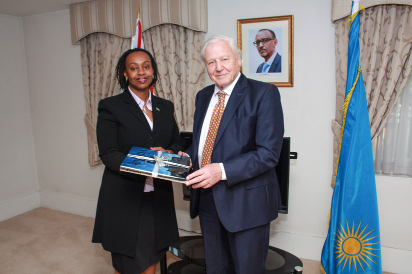 Her Excellency Yamina Karitanyi the High Commissioner of Rwanda to the UK presenting a gift to Sir David Attenborough at the High Commission.