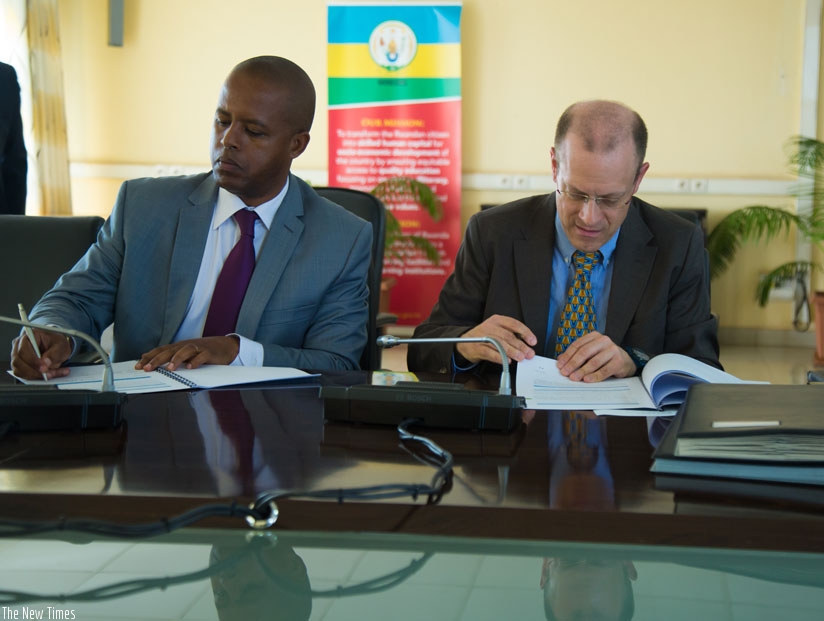The Director General of WDA, Jerome Gasana (L), signs a Memorandum of Understanding with Alexandre Boin, Director for Rwanda, DR Congo and Burundi, Swiss Foundation for Technical C....