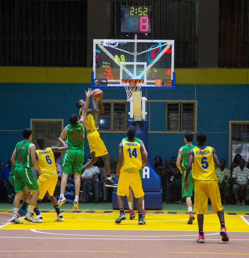 Rayan Mamdi (#14) tries to block Osborn Shema. (All photos by Faustin Niyigena)