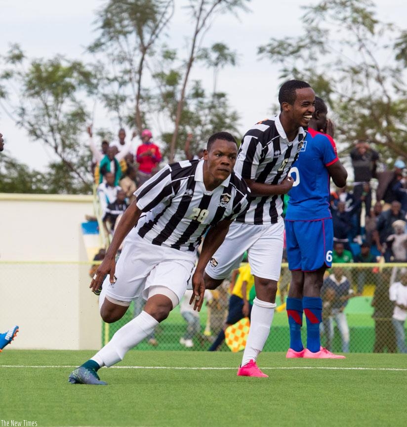 Rwatubyaye (L) wheels away to celebrate after completing his hat-trick in APR's 4-1 against Mbabane Swallows in CAF Champions League. / File.