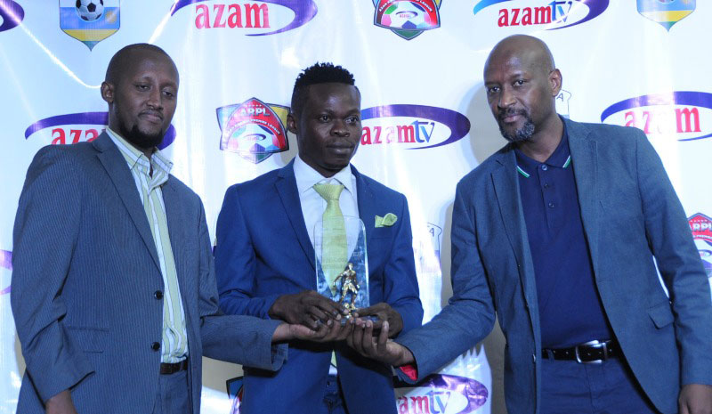 Kwizera receives his award from FERWAFA president Vincent Nzamwita (R) and Azam Rwanda Operations Manager, Faradjallah Ndagano (L). / Courtesy
