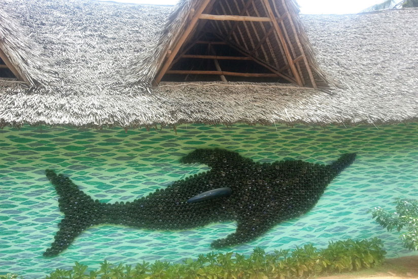 A mural of a dolphin made with bottles picked from the beaches. / Allan Brian Ssenyonga.