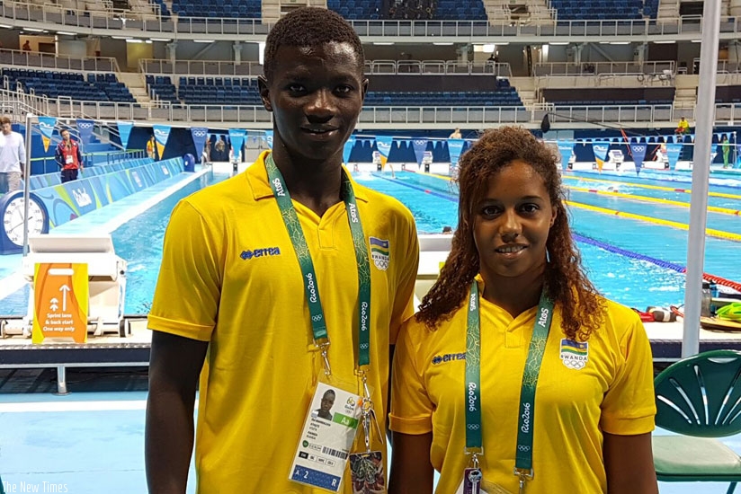 Rwandan swimmers Imaniraguha and Umurungi  pose for a photo on arriving in Rio for the Olympic Games. (Courtesy)