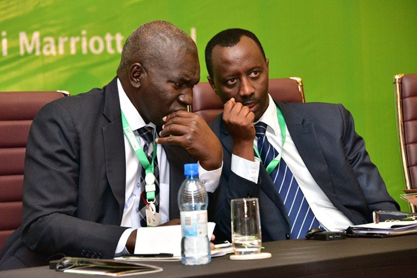 The AFRACA Secretary General, Saleh Usman Gashua (L), chats with the Chief Executive Officer of BRD, Alex Kanyankole, during the meeting in Kigali yesterday. (Nadege Imbabazi)