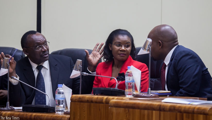 Cabinet ministers (L-R) Francois Kanimba of Trade and Industry,  Judith Uwizeye of Public Service and Labour, and Jean Philbert Nsengimana of Youth and ICT consult with each other ....