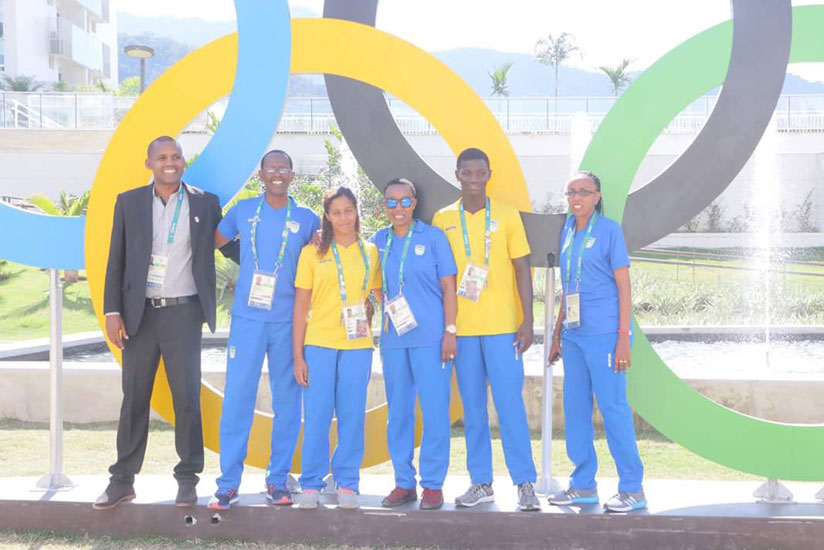 L-R; Manirarora, Fidele Sebalinda, Joannah Umurungi, Clarisse  Ingabire, Eloi Imaniraguha and Henriette Umulisa pose behind the Olympic rings in Rio. (Courtsey)