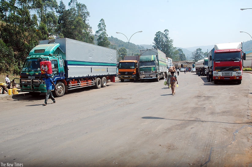 Trucks await clearance at Gatuna border post. EAC is seeking to phasing out the US Dollar as a medium of exchange in cross-border trade and instead use local currencies. / File.