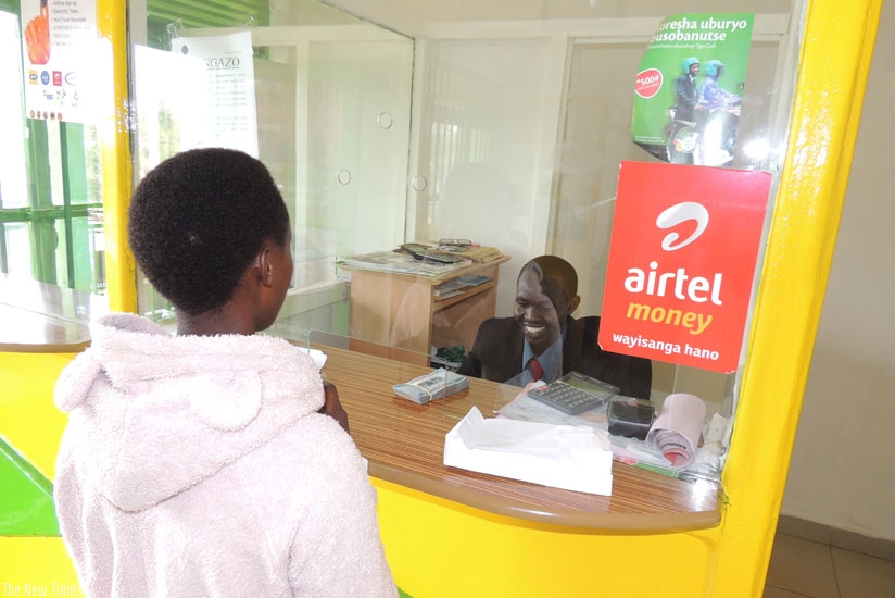 A customer being served at the SACCO that was started using university students' savings. The institution mainly funds youth projects. (All photos by Appolonia Uwanziga)
