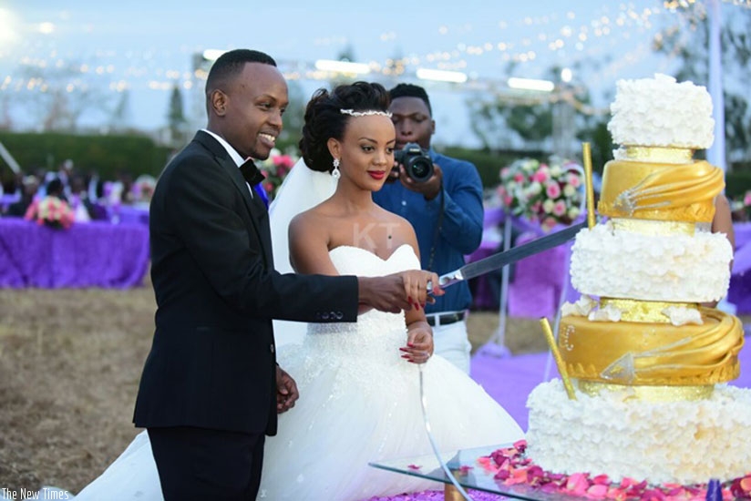The newlywed couple cut the cake. (Courtesy photos/KigaliToday)