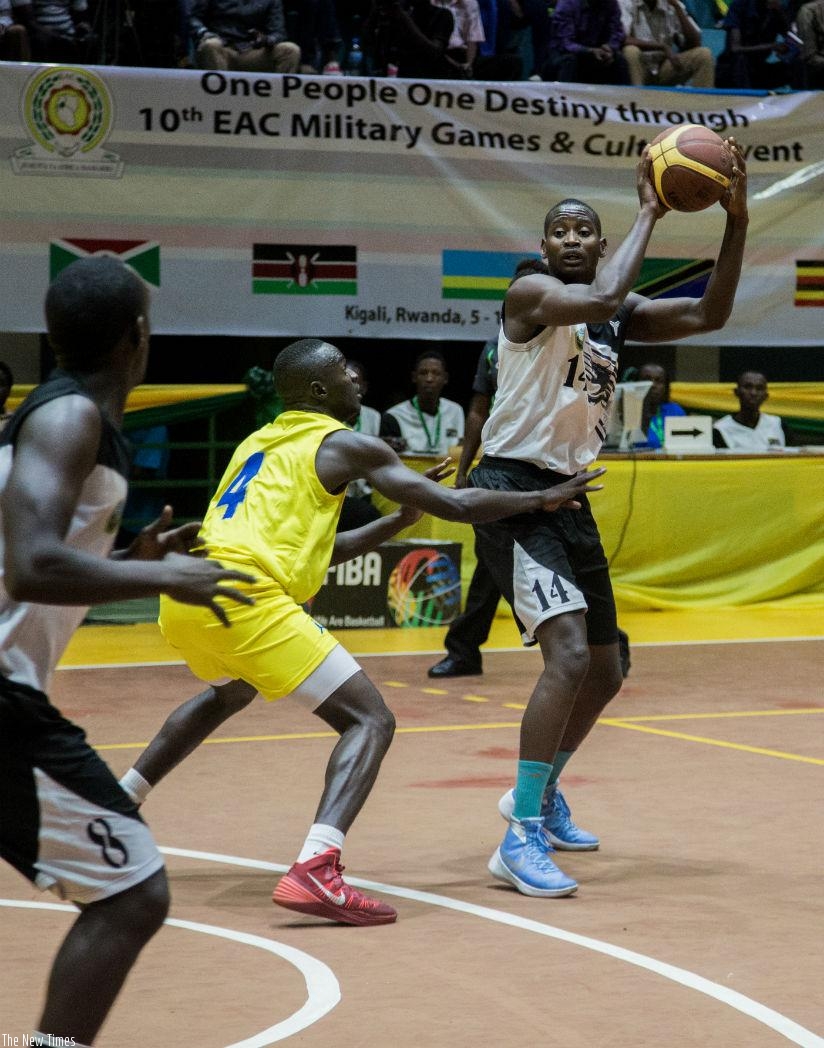 Rwanda's Olivier Shyaka (R) finished with the game high 28 points as RDF beat TPDF 78-64 on Wednesday. / Faustin Niyigena.