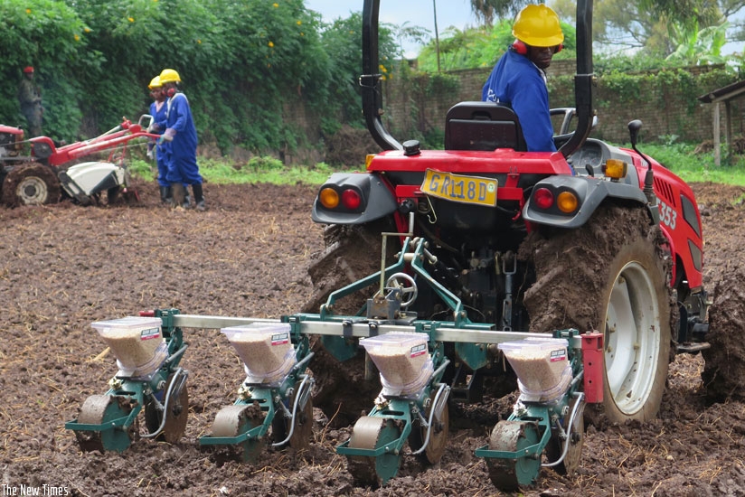 A trainee in agriculture mechanisation plants maize seeds using a machine at IPRC South in Huye District last year. (File photo)