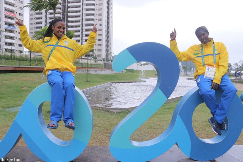 Nyirarukundo (left) and teammate Claudette Mukasakindi pose on the Rio Olympics rings. The 18-year old will compete in women's 10,000m final today. (Courtesy)