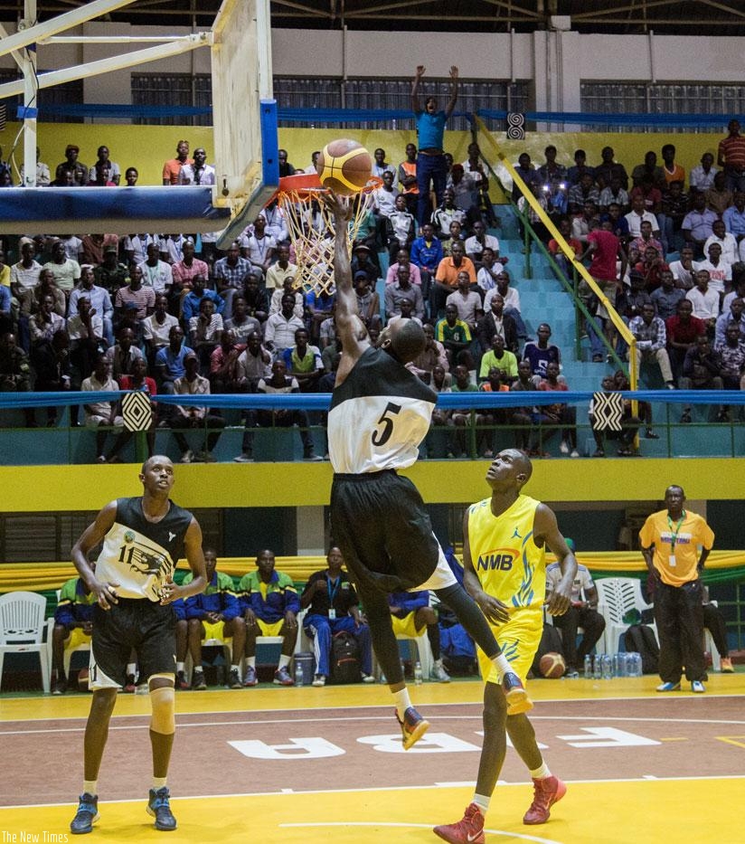 Rwanda's Ali Kubwimana scores against Tanzania in the earlier basketball game between the two teams. (Faustin Niyigena)