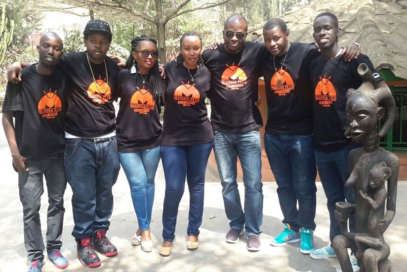Masoud Kipanya (3rd right), founder of MaishaPlus East Africa, poses in a group photo with the rest of the Rwanda Maisha Plus team. 