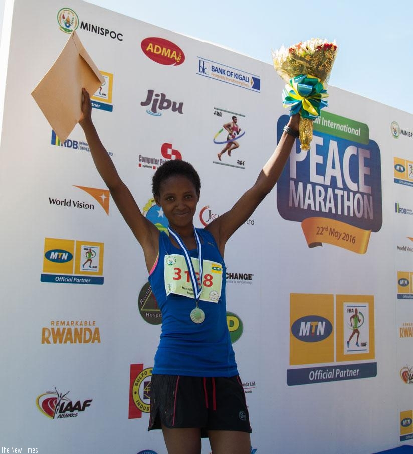 Salome Nyirarukundo celebrates after finishing second in Kigali Peace Half Marathon early this year. / File