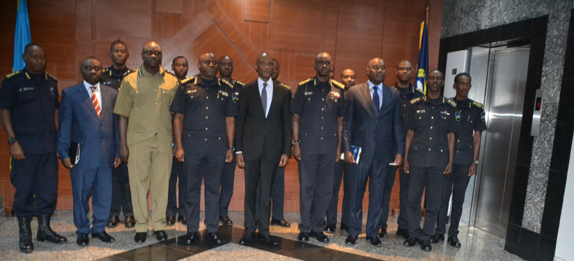 Rwanda National Police and Uganda Police Force officials pose for a group photo after the meeting in Kigali yesterday. / Courtesy