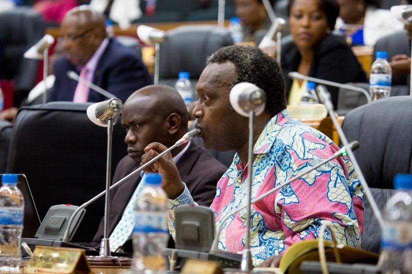 PAC chair Nkusi speaks as committee member Theodomir Niyonsenga looks on during a past session.  (File)