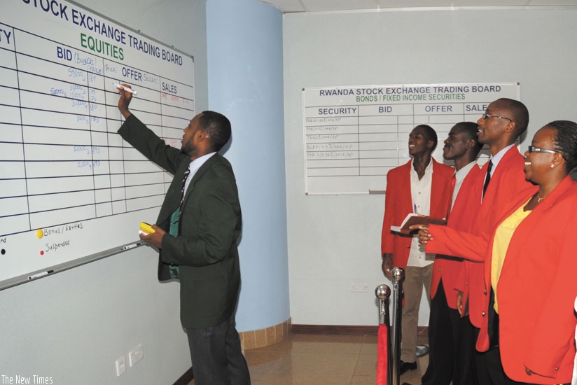 Stock brokers at the RSE trading floor. Activity has been low at the exchange this year. (File photo.)